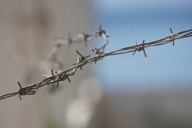 Close up of barbed wire by Charles Roffey Creative Commons