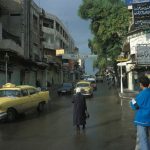 Street scene with people and taxis