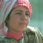 Woman in red and white headscarf