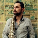 The Syrian musician Basel Rajoub holding saxophone